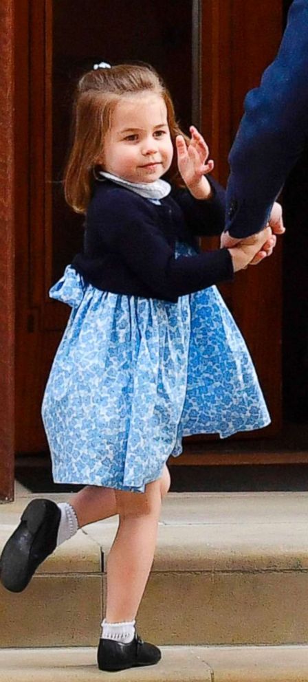 PHOTO:Princess Charlotte of Cambridge turns to wave at the media a by her father Britain's Prince William, Duke of Cambridge, at the Lindo Wing of St Mary's Hospital in central London, April 23, 2018.