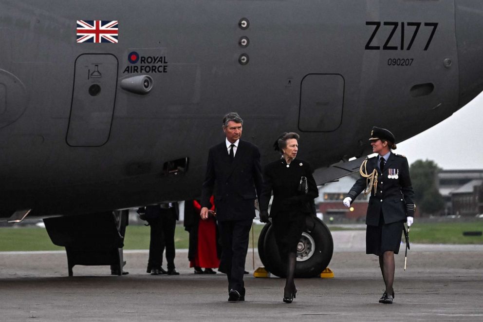 PHOTO: Princess Anne and Vice Admiral Timothy Laurence are greeted by Station Commander Group Captain McPhaden, having disembarked from the C-17 carrying the coffin of Queen Elizabeth II at the Royal Air Force Northolt airbase on Sept. 13, 2022.