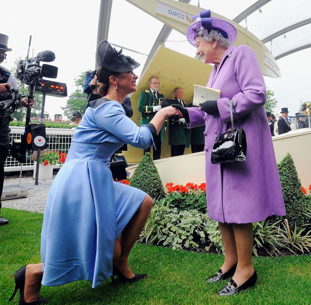 PHOTO: Queen Elizabeth II is congratulated by Princess Haya bint Hussein on Ladies' Day during day three of Royal Ascot at Ascot Racecourse on June 20, 2013, in Ascot, England.