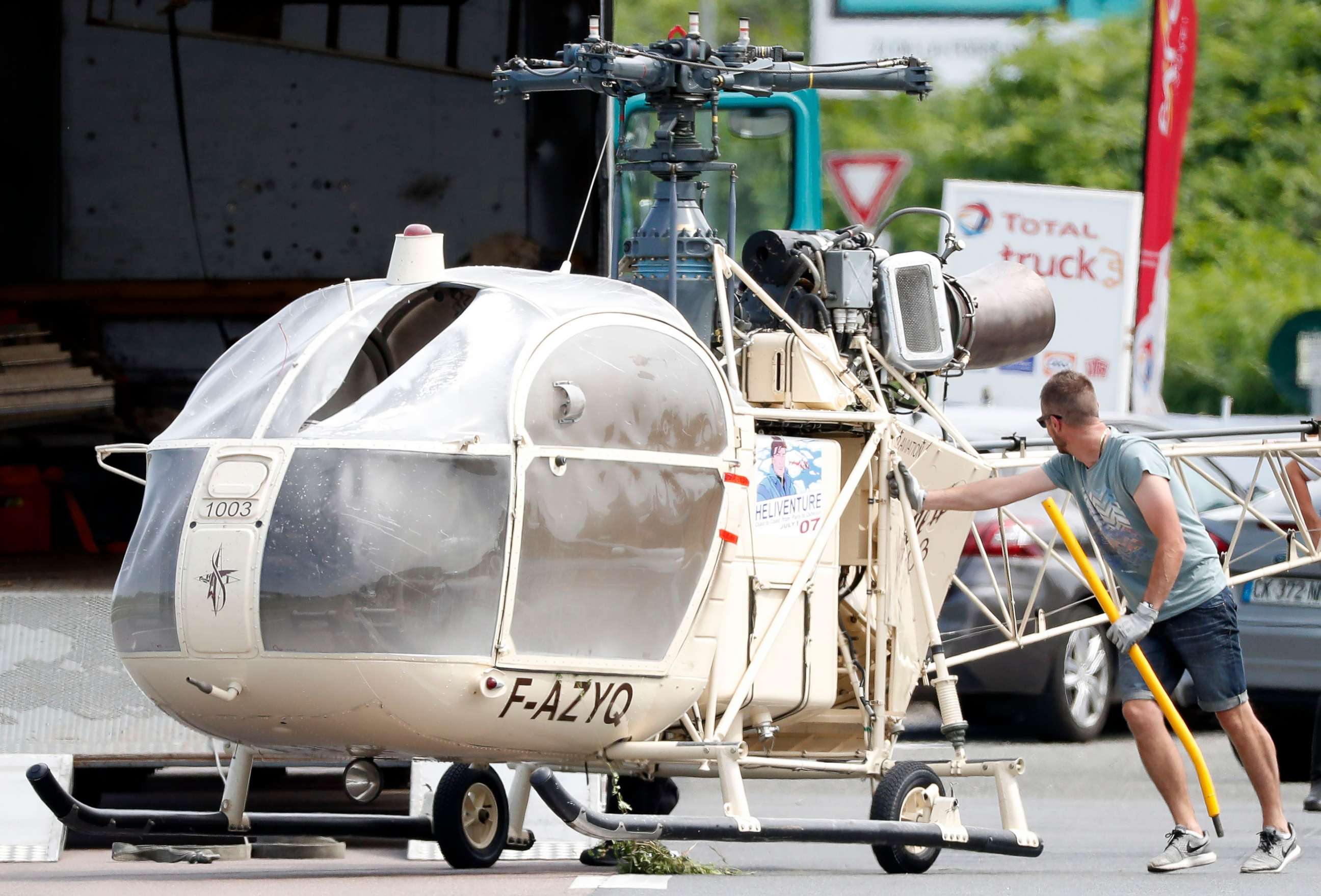 PHOTO: Investigators transport an Alouette II helicopter allegedly abandoned by French prisoner Redoine Faid and suspected accomplices after his escape from the prison of Reau, in Gonesse, north of Paris, July 1, 2018.