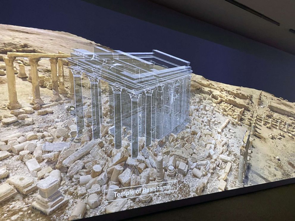 PHOTO: Large-scale projections show digitized reconstructions of historic sites that were destroyed by conflict in recent years. The Temple of Baalshamin, shown here, was destroyed by ISIS. 