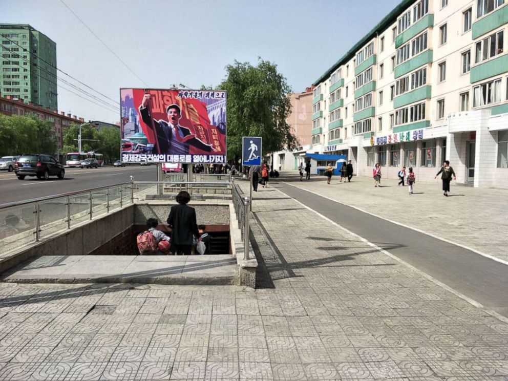 PHOTO: A propaganda poster near a pedestrian underpass on Ryomyong Street, Pyongyang, North Korea, August 2018.