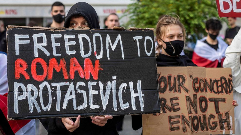 PHOTO: Belarusians living in Poland and Poles supporting them hold up a placard reading "Freedom to Roman Protasevich" during a demonstration in front of the European Commission office in Warsaw on May 24, 2021.