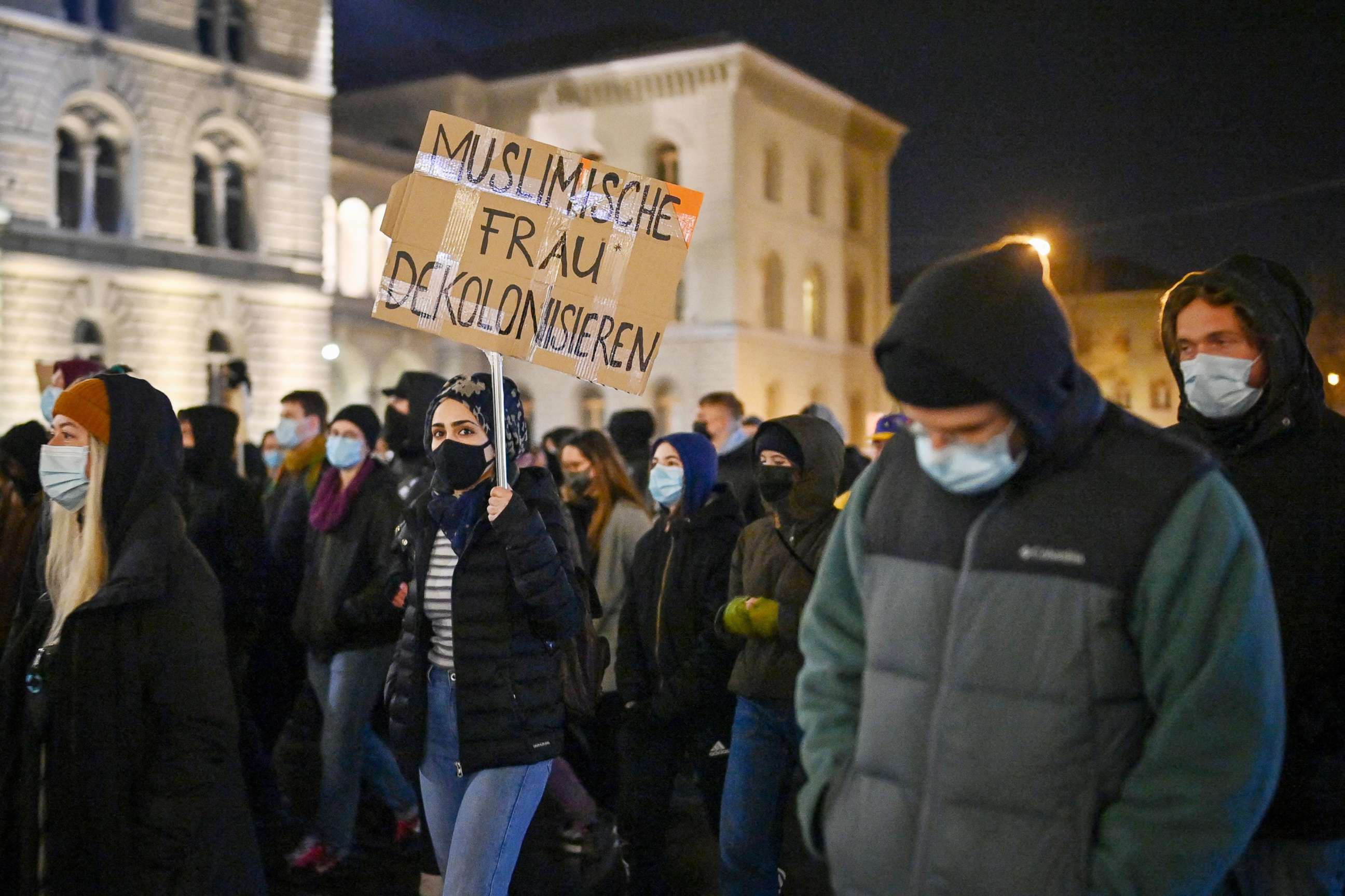 PHOTO: People take part in a protest after Swiss voters narrowly approved a measure that bans full-face coverings in public, in Bern, Switzerland, on March 7, 2021.