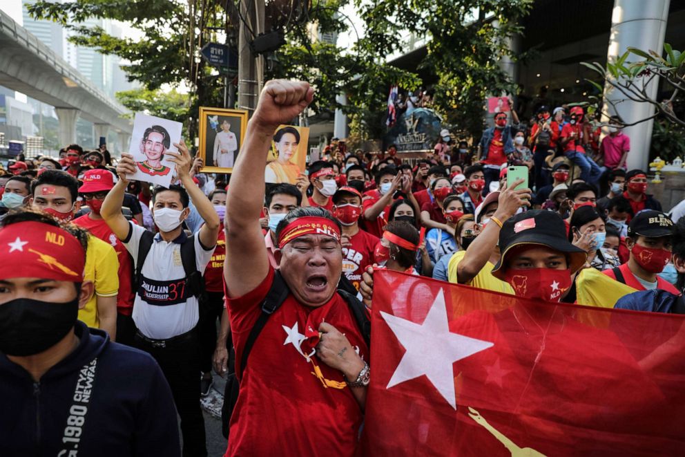 PHOTO: People hold up images of Myanmar's de-facto leader, Aung San Suu Kyi, while shouting at a protest outside the country's embassy in Bangkok, Thailand, on Feb. 01, 2021 in Bangkok, Thailand.