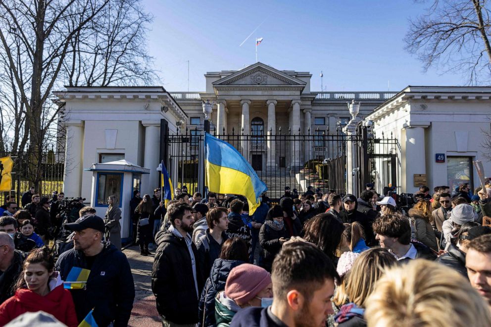 PHOTO: Ukrainian and Polish demonstrators protest against Russia's invasion of Ukraine, in front of Russian embassy in Warsaw, Poland, on Feb. 24, 2022.