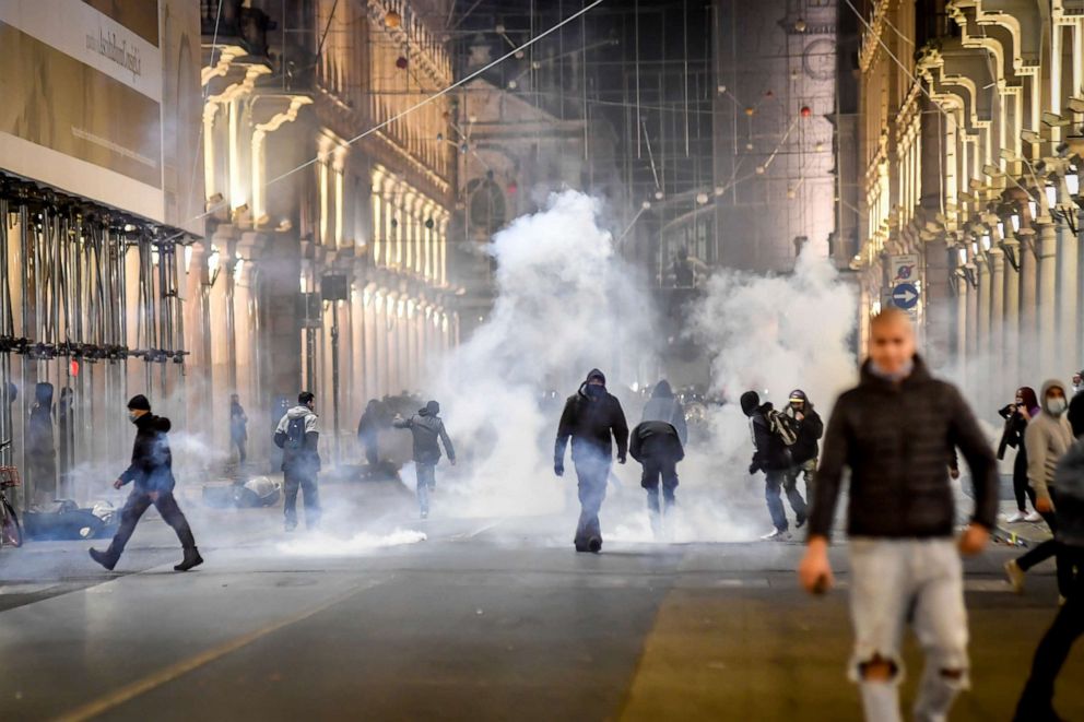 PHOTO: Smoke billows as clashes broke out during a protest against the government's new measures to curb the spread of COVID-19 in Turin, Italy, on Oct. 26, 2020.