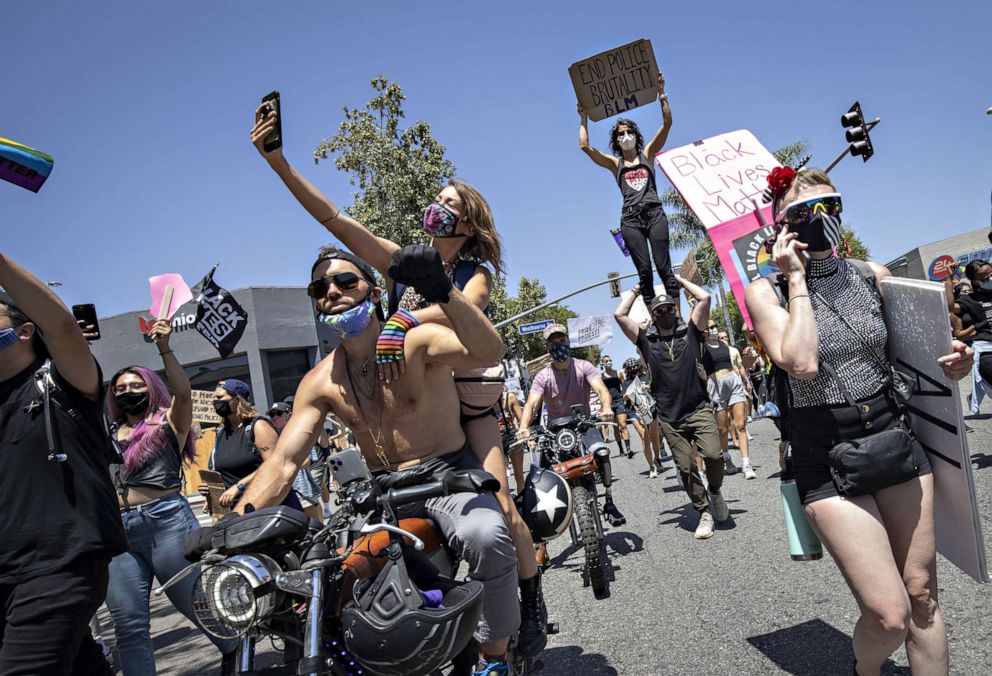 PHOTO: People march down Santa Monica Boulevard to demonstrate against police brutality after the death of George Floyd in Minnesota, in West Hollywood, Calif., June 14, 2020.