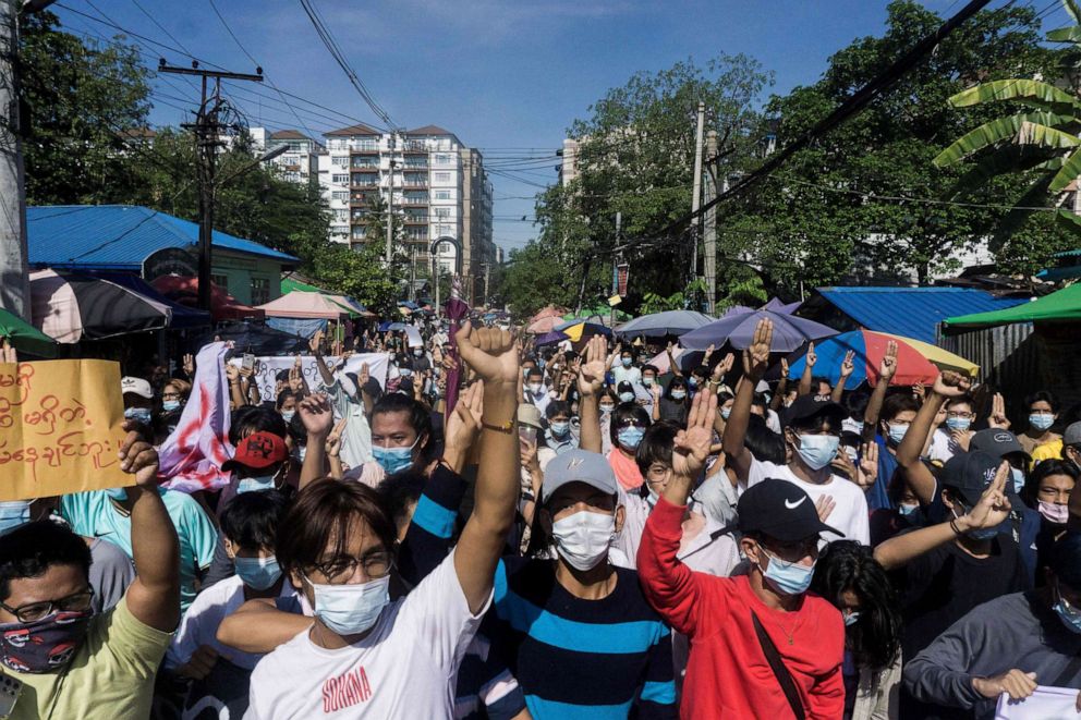 PHOTO: Protesters make the three-finger salute during a demonstration against the military junta in Yangon, Myanmar, on May 14, 2021.