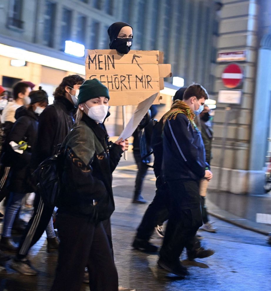PHOTO: People take part in a protest after Swiss voters narrowly approved a measure that bans full-face coverings in public, in Bern, Switzerland, on March 7, 2021.
