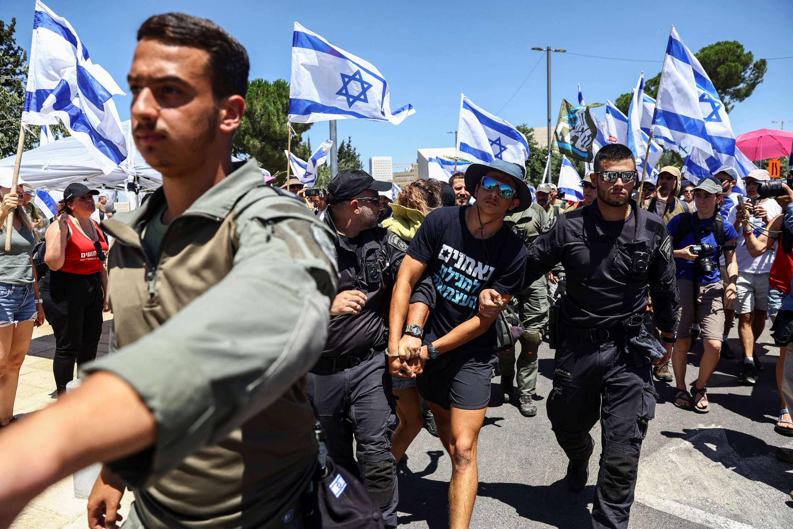 PHOTO: Israeli police detain a protester during a demonstration against Israeli Prime Minister Benjamin Netanyahu and his nationalist coalition government's judicial overhaul, in Jerusalem July 24, 2023.