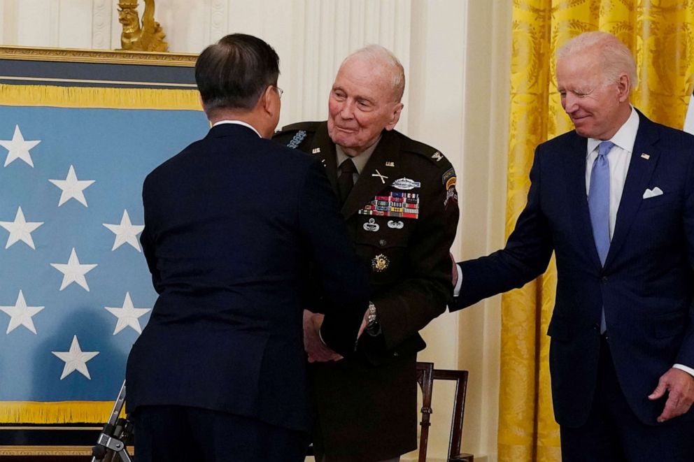 PHOTO: President Joe Biden looks on as retired U.S. Army Col. Ralph Puckett Jr. is greeted by South Korean President Moon Jae-in, during a Medal of Honor ceremony in the East Room of the White House, May 21, 2021, in Washington.
