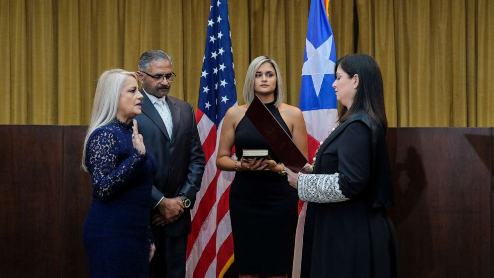 PHOTO: Justice Secretary Wanda Vazquez is sworn in as governor of Puerto Rico by Supreme Court Justice Maite Oronoz, in San Juan, Puerto Rico, Wednesday, Aug. 7, 2019.