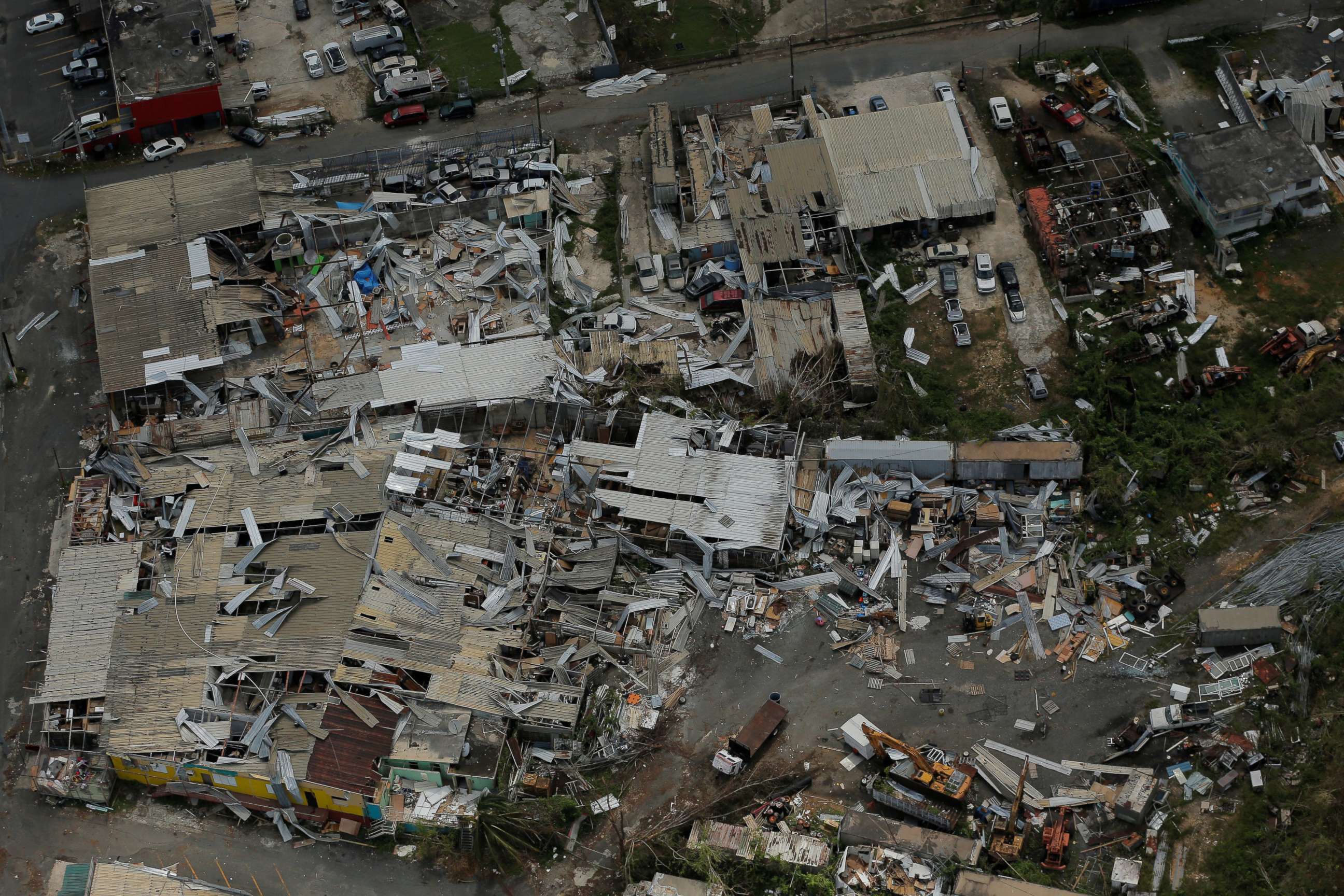 PHOTO: Aluminum roofing is seen twisted and thrown off buildings as recovery efforts continue following Hurricane Maria near San Jose, Puerto Rico, Oct. 7, 2017.