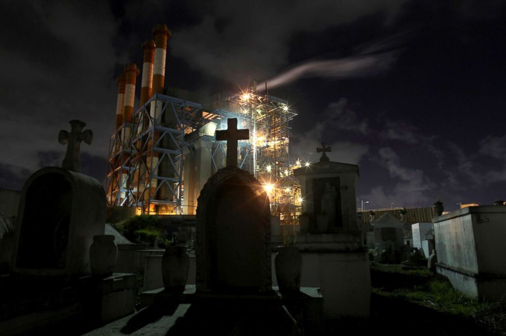 PHOTO: Central Palo Seco power station of the Puerto Rico Electric Power Authority (PREPA) is seen behind a cemetery, in San Juan, Puerto Rico, Jan. 22, 2018.