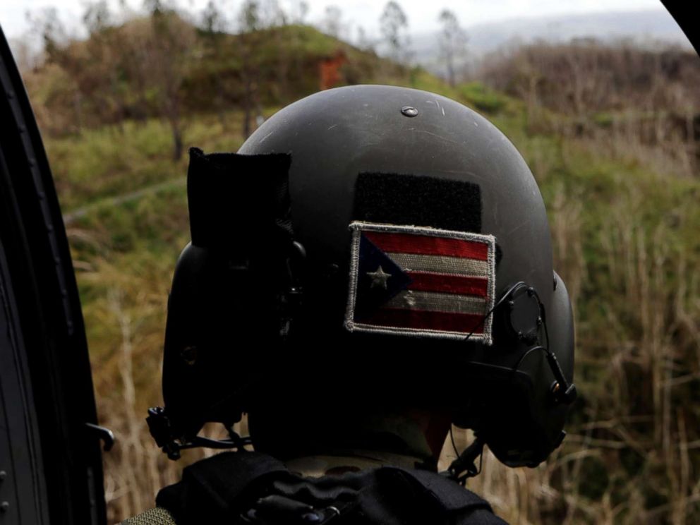 PHOTO: Sergeant First Class Eladio Tirado, who is from Puerto Rico, looks for a landing spot for a UH-60 Blackhawk helicopter during recovery efforts following Hurricane Maria near Ciales, Puerto Rico, Oct. 7, 2017.