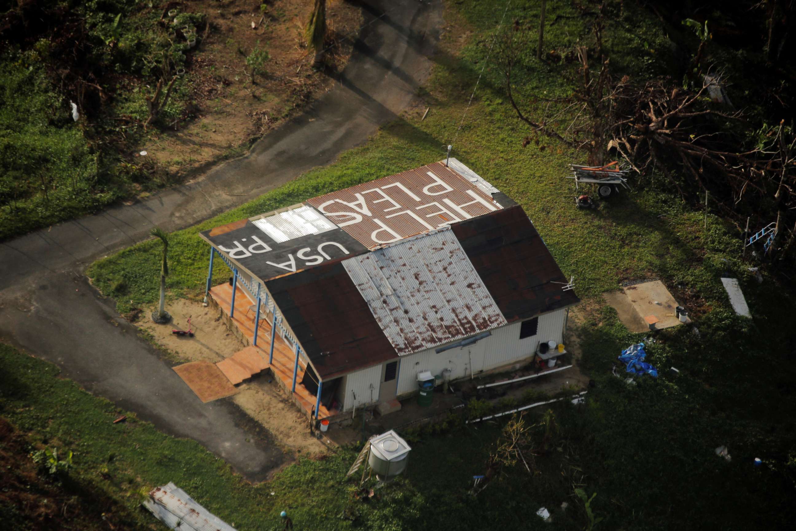 PHOTO: A message written on the rooftop is seen from the air during recovery efforts following Hurricane Maria near Humacao, Puerto Rico, Oct. 10, 2017.