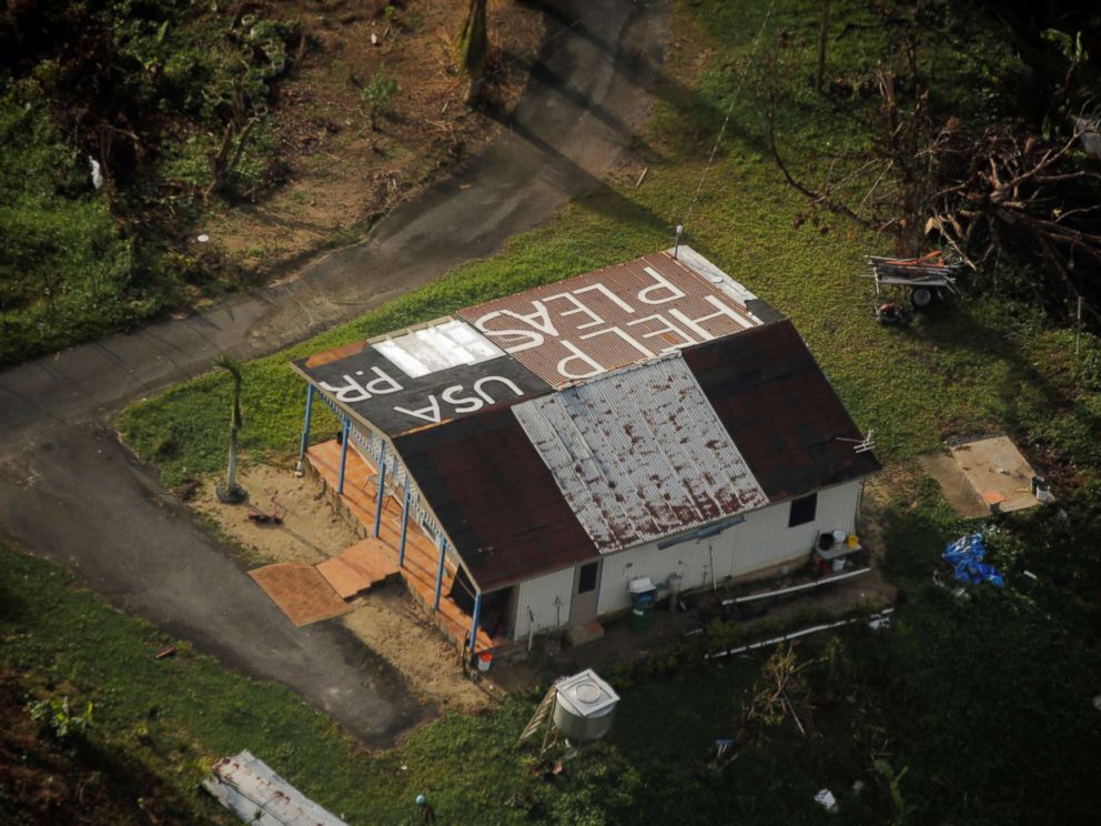 PHOTO: A message written on the rooftop is seen from the air during recovery efforts following Hurricane Maria near Humacao, Puerto Rico, Oct. 10, 2017.