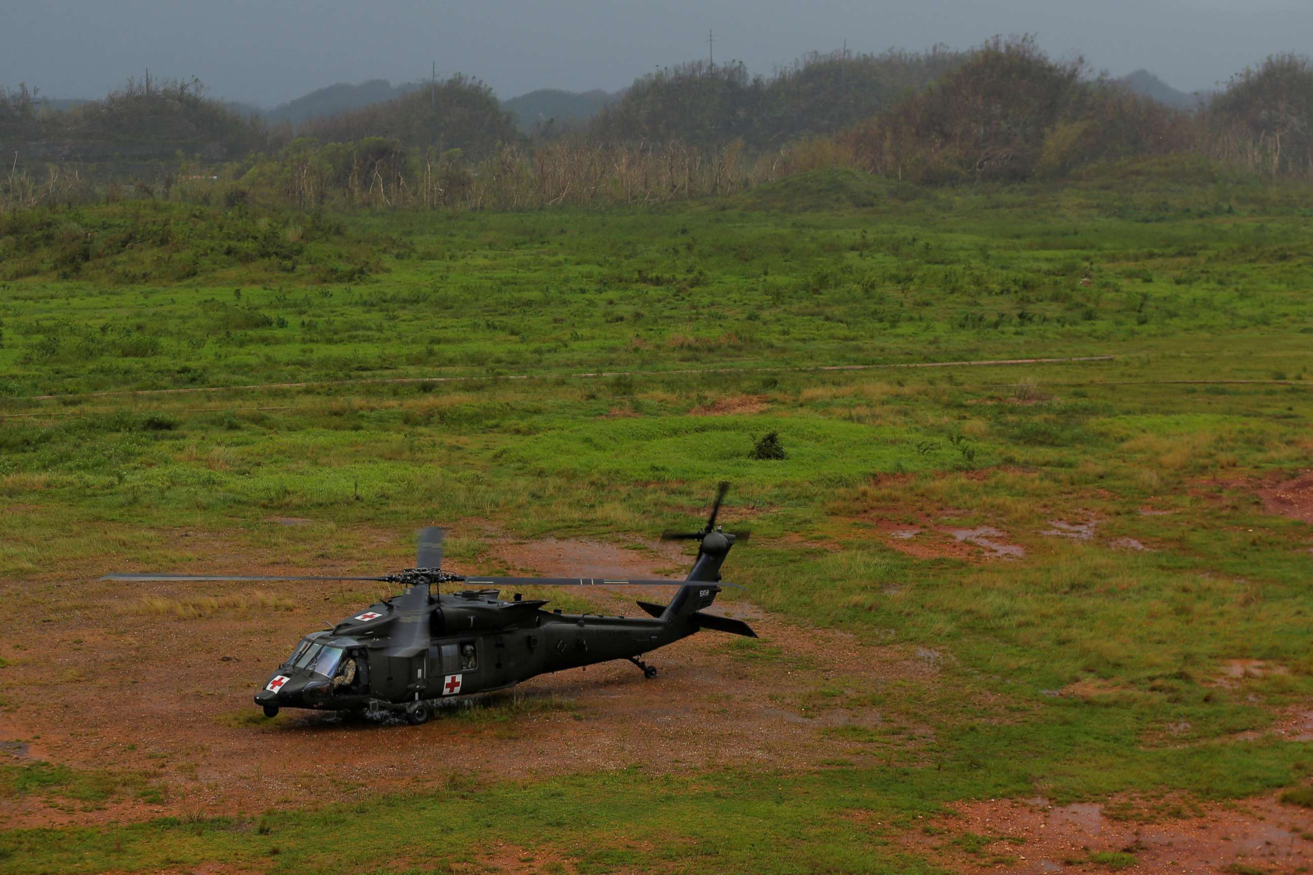 PHOTO: An HH-60 Blackhawk helicopter from 101st Airborne Division's "Dustoff" unit lands in a field to avoid lightning during recovery efforts following Hurricane Maria, in Manati, Puerto Rico, Oct. 5, 2017.