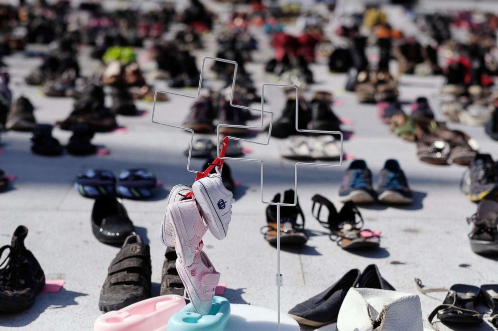 PHOTO: Crosses stand amid shoes displayed in memory of those killed by Hurricane Maria in front of the Puerto Rican Capitol, in San Juan, on June 1, 2018.