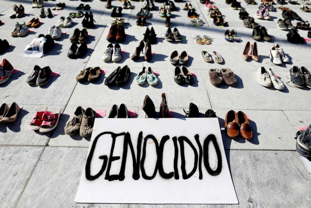 PHOTO:A sign stands amid shoes are displayed to pay tribute to Hurricane Maria's victims in San Juan, Puerto Rico, on  June 1, 2018.