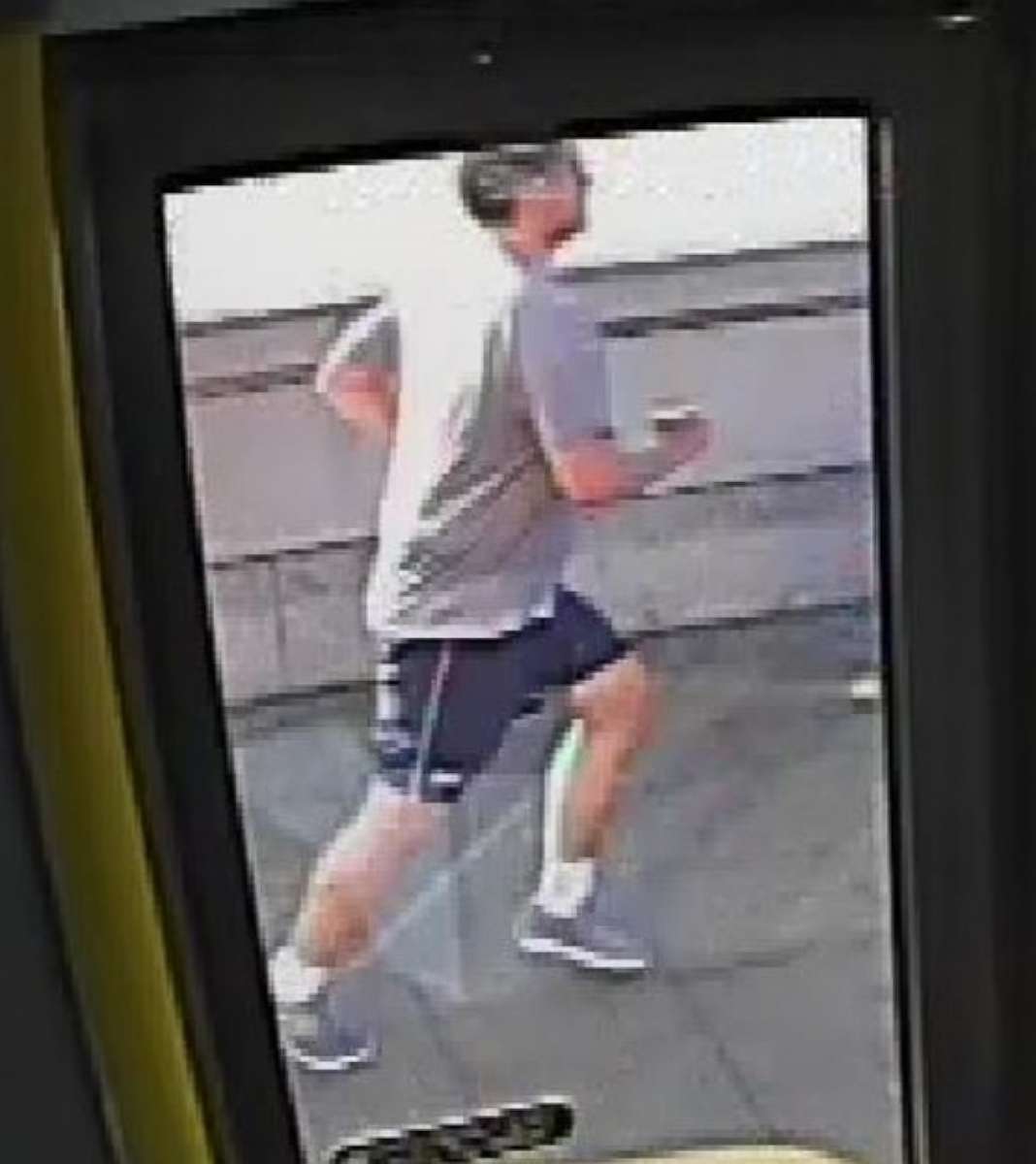 PHOTO: CCTV footage shows a jogger pushing a woman into oncoming traffic on a London road. 