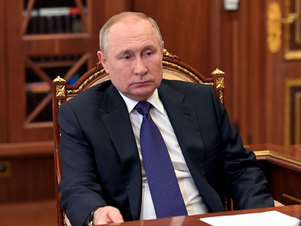 PHOTO: Russian President Vladimir Putin listens to St. Petersburg's governor Alexander Beglov during their meeting in the Kremlin in Moscow, on March 1, 2022.