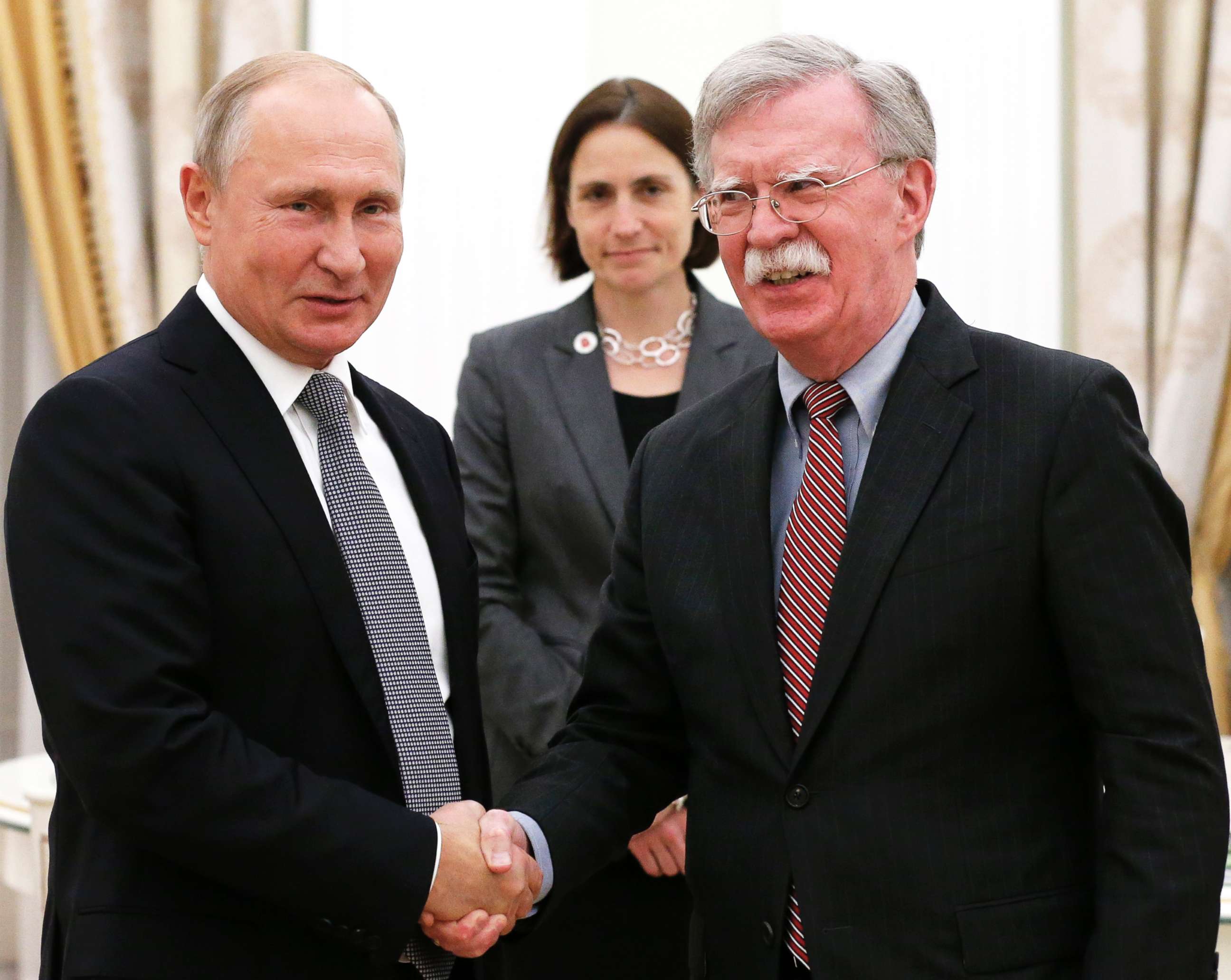 PHOTO: Russian President Vladimir Putin, left, and U.S. National security adviser John Bolton shake hands during their meeting in the Kremlin in Moscow, Oct. 23, 2018.