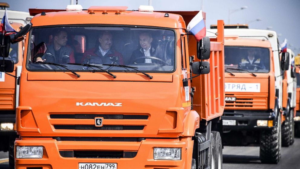 Putin Inaugurates Controversial Bridge By Driving A Truck Across To