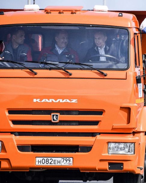 Putin inaugurates controversial bridge by driving a truck across to seized  peninsula Crimea - ABC News