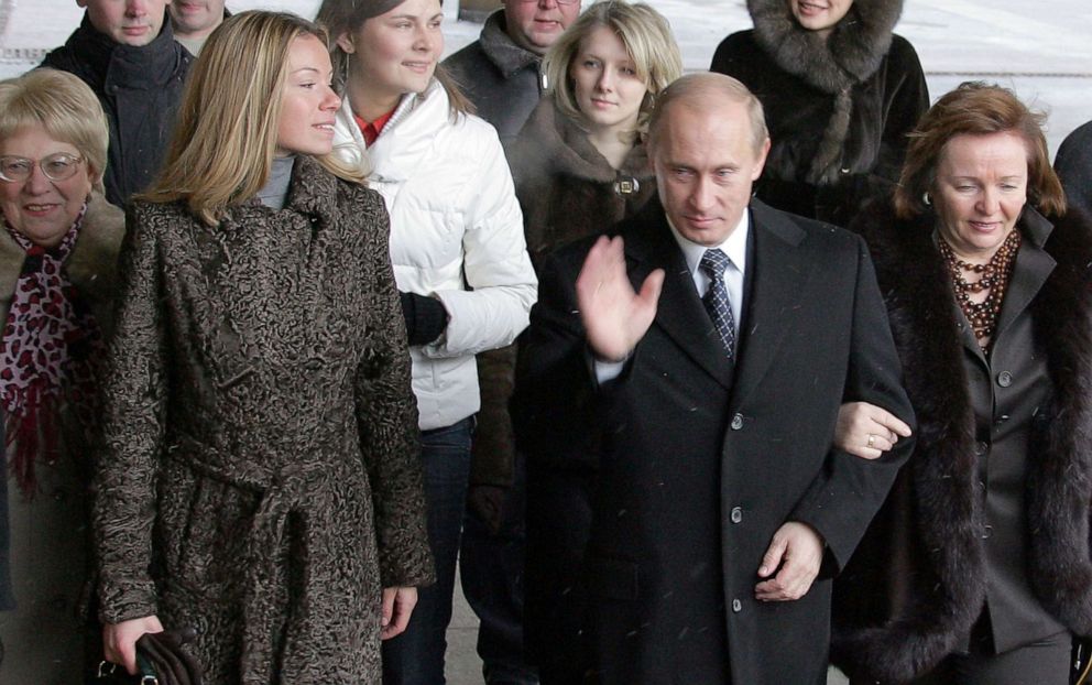 PHOTO: Russian President Vladimir Putin (C), his wife Ludmila (R) and daughter Maria (2ndL) enter a Moscow polling station, on Dec. 2, 2007, to cast their votes in Russia's parliamentary elections. 