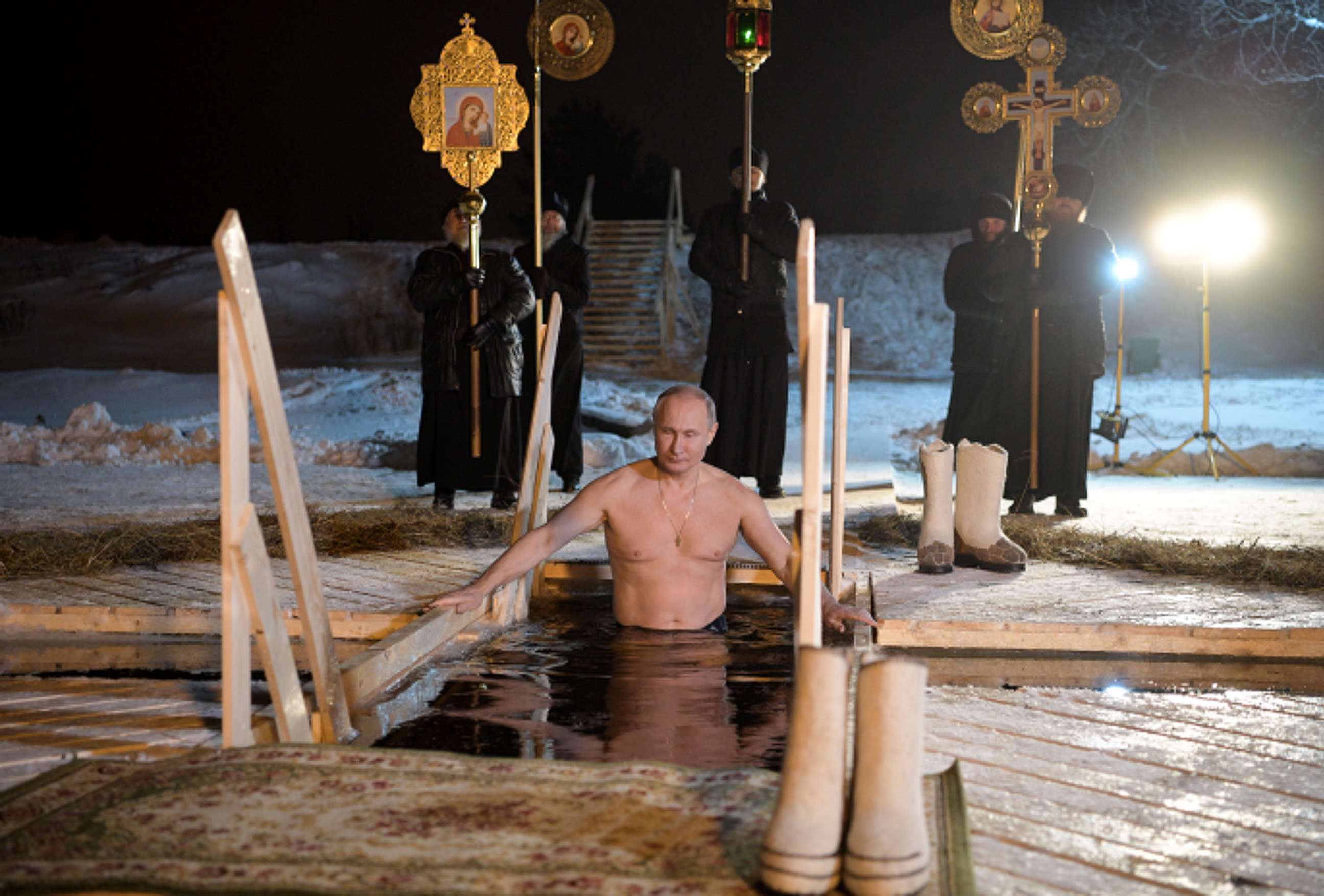 PHOTO: Russia's President Vladimir Putin dips in the icy waters of Lake Seliger during the celebration of Epiphany.