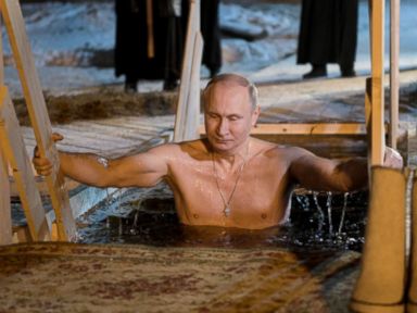 PHOTO: Russias President Vladimir Putin dips in the icy waters of Lake Seliger during the celebration of Epiphany.