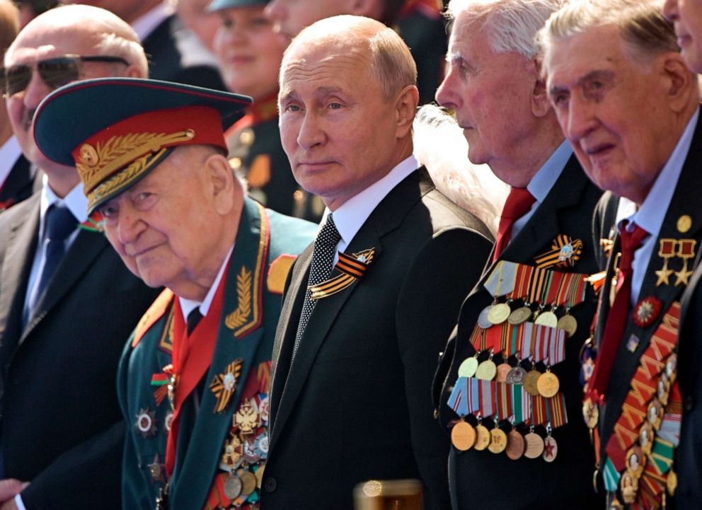 PHOTO: Russian President Vladimir Putin, center, watches the Victory Day military parade marking the 75th anniversary of the Nazi defeat in Moscow.