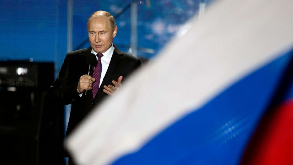 PHOTO: In this March 14, 2018 file photo Russian President Vladimir Putin speaks in front of a Russian National flag in Sevastopol, Crimea.
