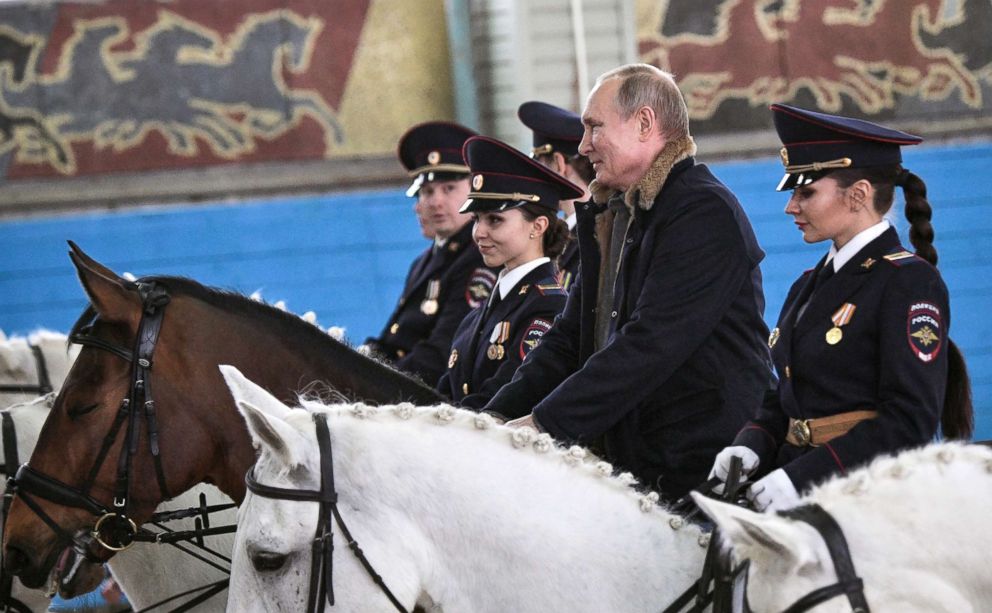 PHOTO: Russian President Vladimir Putin rides a horse on a visit to a mounted police unit in Moscow, March 7, 2019.