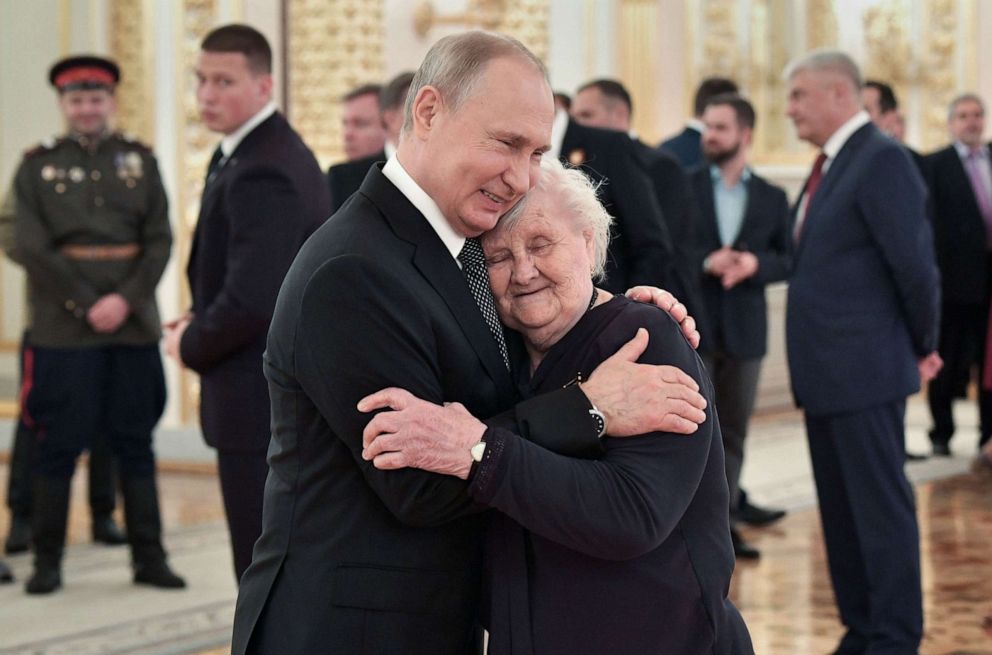 PHOTO: Russian President Vladimir Putin embraces his teacher, Vera Gurevich, at a reception marking the 74th anniversary of the victory over Nazi Germany, at the Kremlin in Moscow, May 9, 2019.