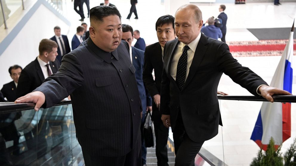 PHOTO: Russian President Vladimir Putin, right, and North Korea's leader Kim Jong Un take an escalator heading to the talks in Vladivostok, Russia, Thursday, April 25, 2019.