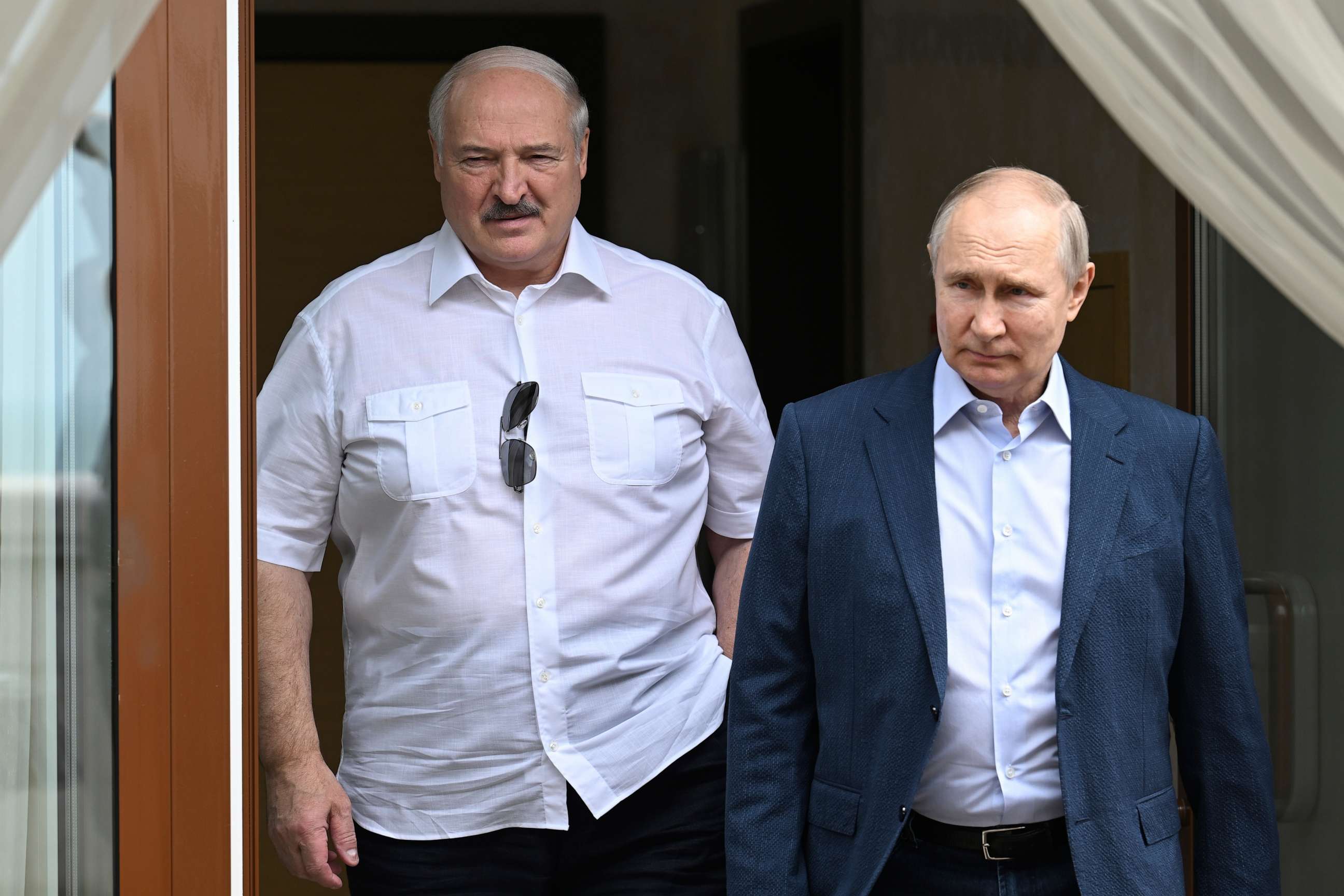 PHOTO: Russian President Vladimir Putin, right, and Belarusian President Alexander Lukashenko walk during their meeting at the Bocharov Ruchei residence in the resort city of Sochi, Russia, Friday, June 9, 2023.