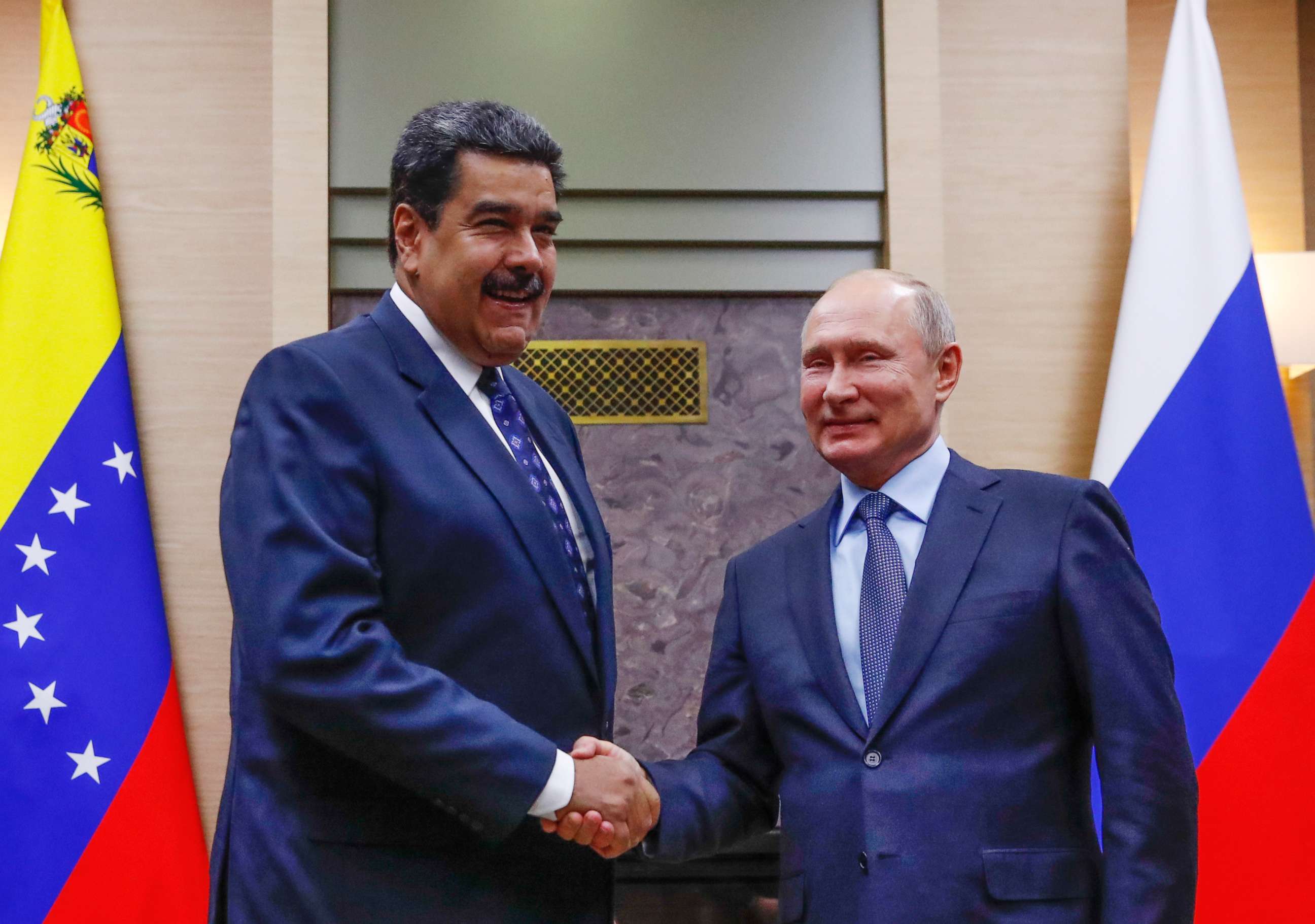PHOTO: Russian President Vladimir Putin, right, shakes hands with his Venezuelan counterpart Nicolas Maduro during their meeting at the Novo-Ogaryovo residence outside in Moscow, Dec. 5, 2018. 