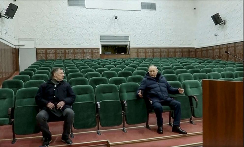 PHOTO: In this photo taken from video released by Russian TV Pool on Sunday, March 19, 2023, Russian President Vladimir Putin gestures while speaking to Russian Deputy Prime Minister Marat Khusnullin at the Mariupol theater in the Donetsk region, Ukraine.