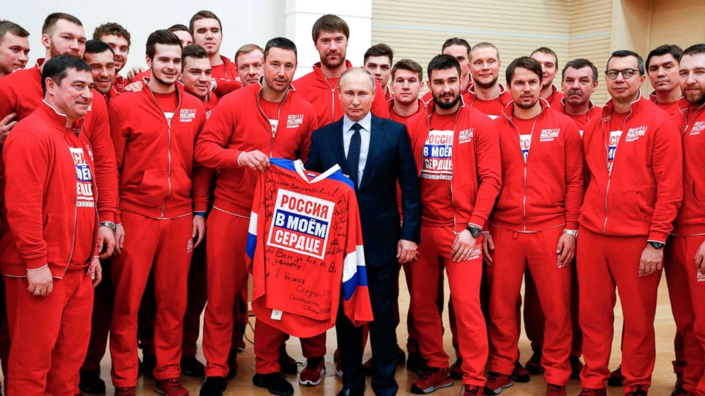 Russian President Vladimir Putin poses for a picture with ice hockey players during a meeting with Russian athletes and team members, who will take part in the upcoming 2018 Pyeongchang Winter Olympic Games, at the Novo-Ogaryovo state residence outside Moscow, Jan. 31, 2018.