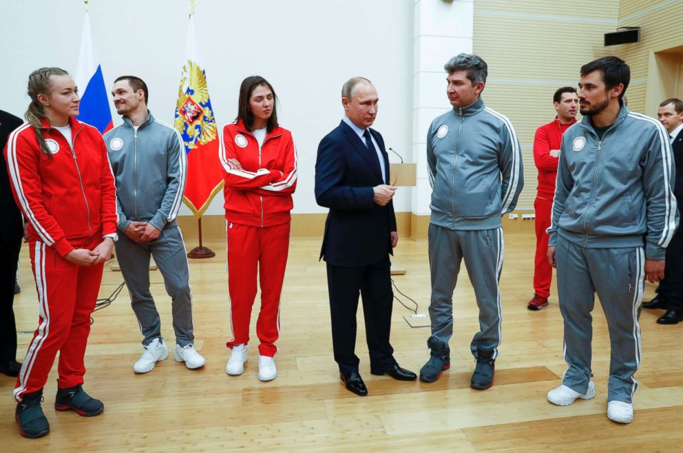 PHOTO: Russian President Vladimir Putin, center, with Russian athletes who will take part in the upcoming 2018 Pyeongchang Winter Olympic Games in South Korea, at the Novo-Ogaryovo residence outside in Moscow, Russia, Jan. 31, 2018.