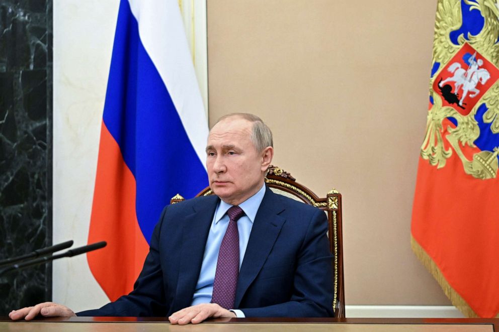 FILE PHOTO: Russian President Vladimir Putin listens to Russian Minister of Defense Sergey Shoygu during their meeting in Moscow on Feb. 14, 2022.