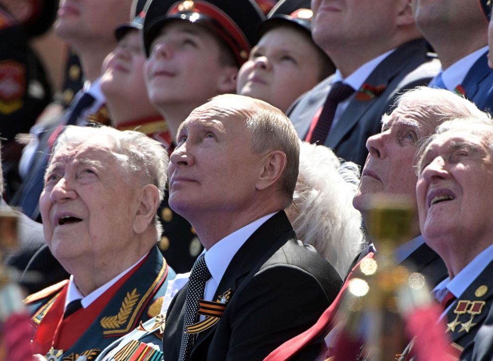 PHOTO: President of Russia and Commander-in-Chief of the Armed Forces Vladimir Putin watches a flyover in Red Square during a Victory Day military parade marking the anniversary of the victory in World War II, on June 24, 2020 in Moscow.