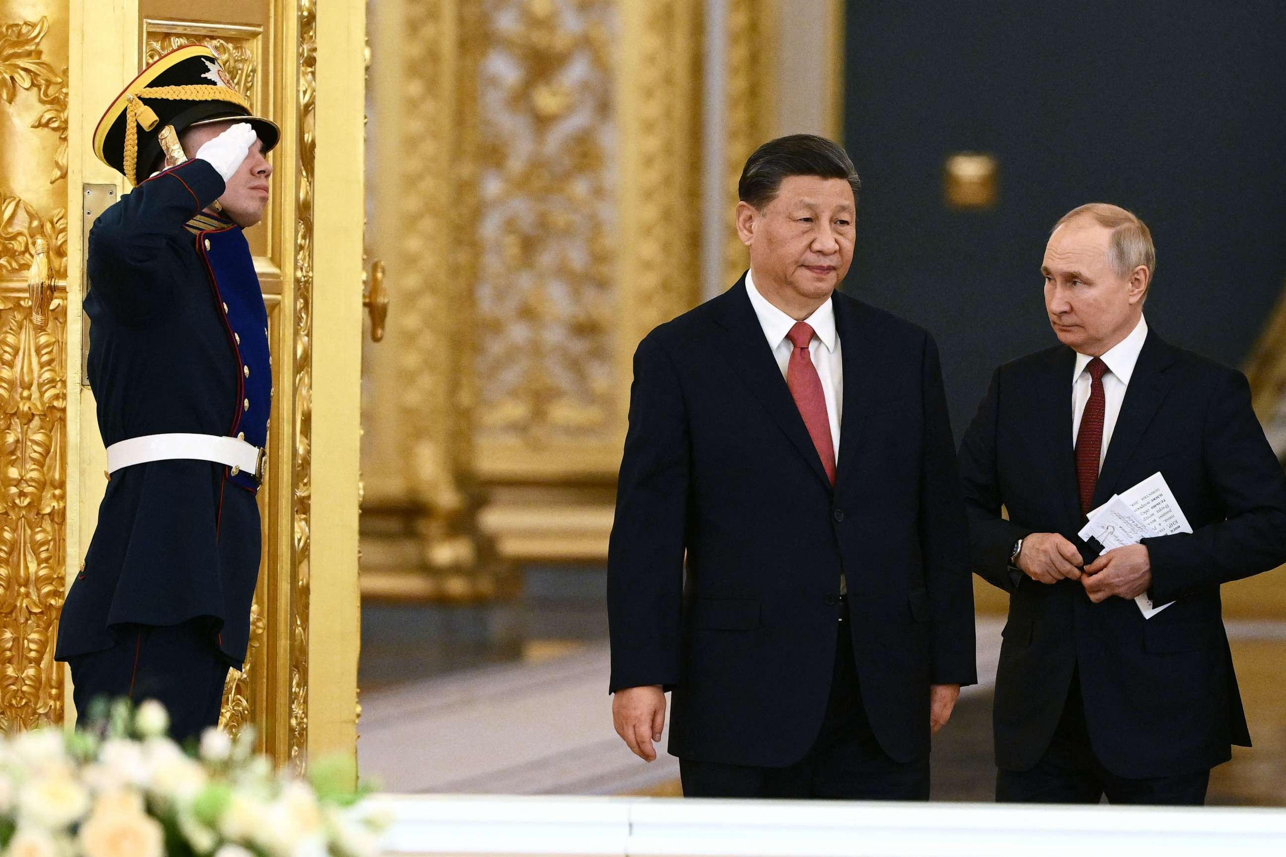 PHOTO: Russian President Vladimir Putin and China's President Xi Jinping enter a hall during a meeting at the Kremlin in Moscow on March 21, 2023.