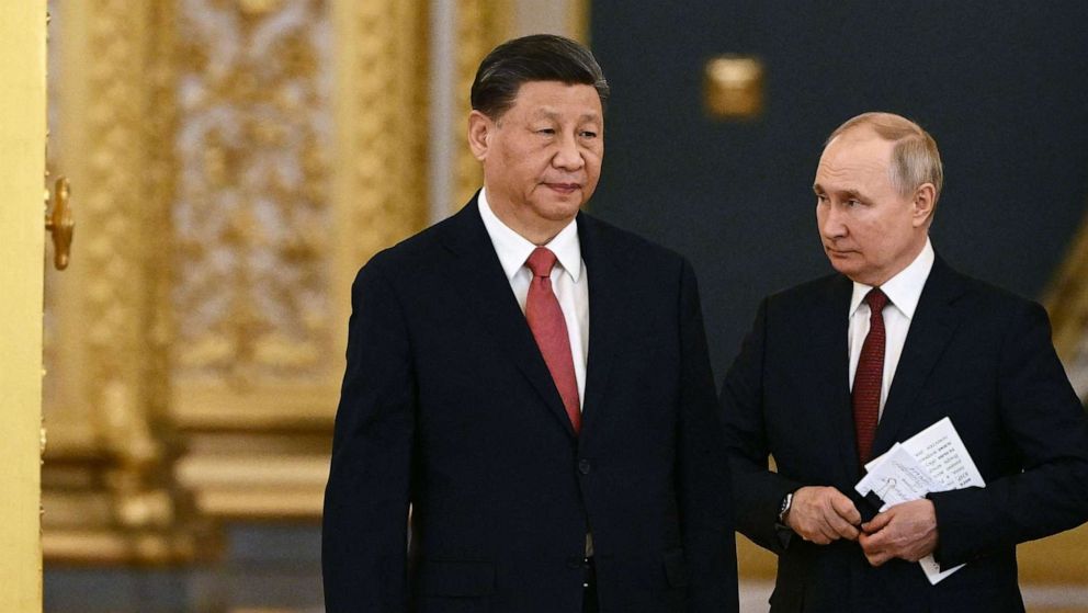 PHOTO: Russian President Vladimir Putin and China's President Xi Jinping enter a hall during a meeting at the Kremlin in Moscow on March 21, 2023.