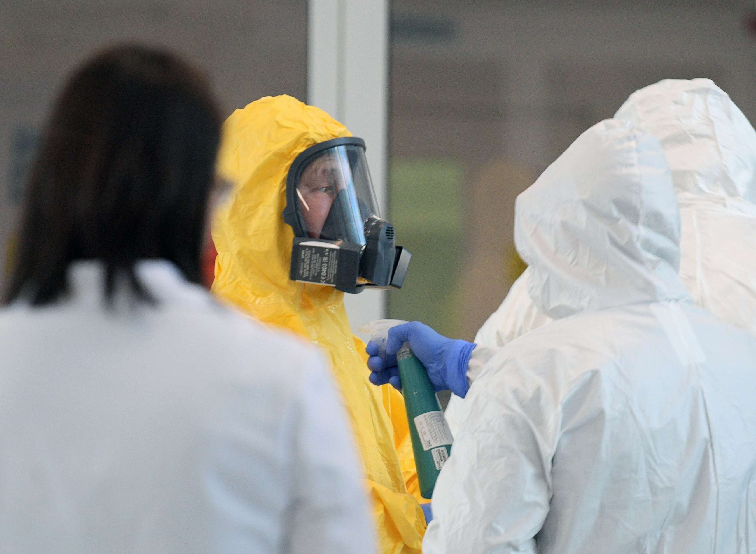 PHOTO: Russian President Vladimir Putin wears protective gear at a hospital for patients infected with coronavirus disease (COVID-19) in Russia March 24, 2020.