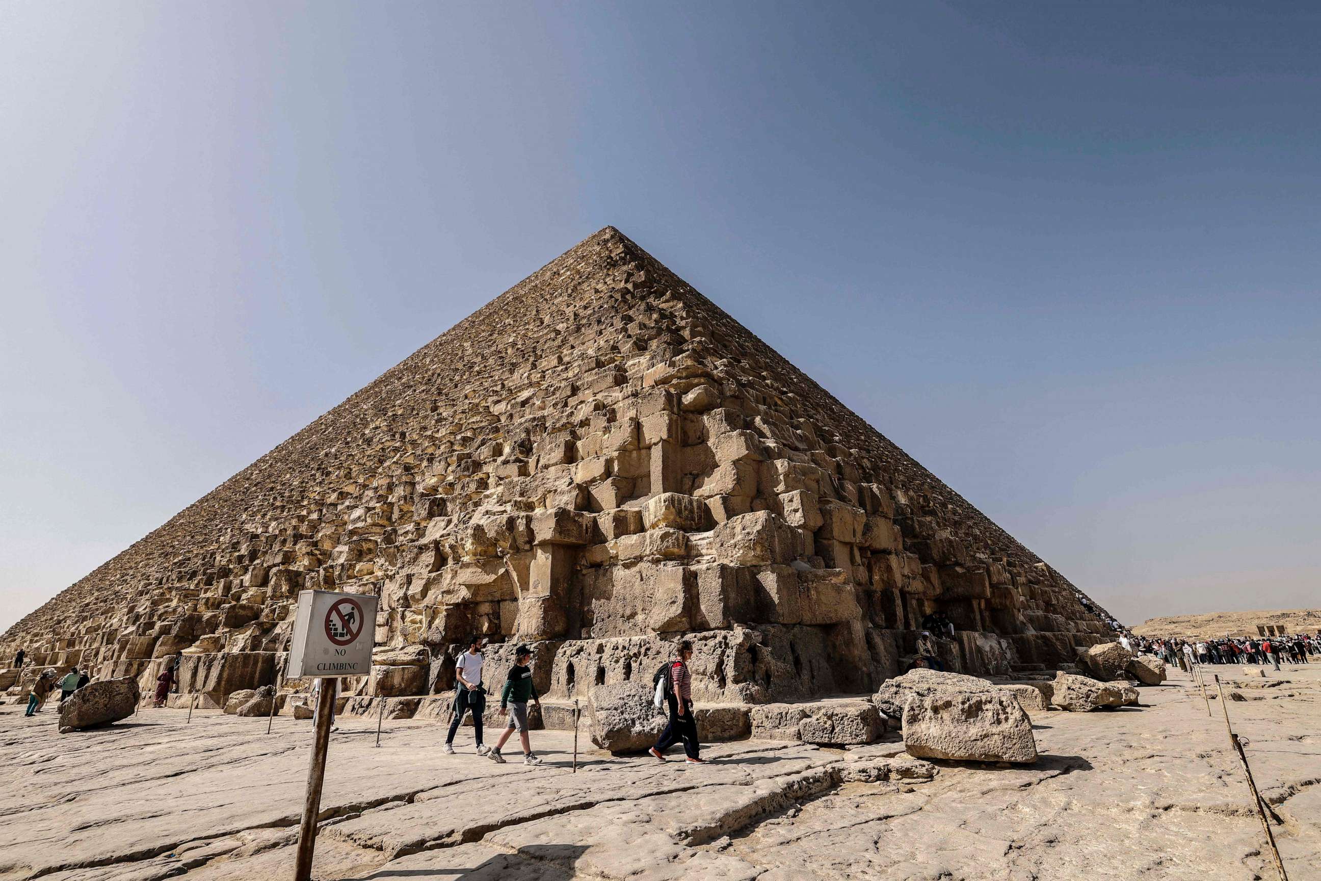 PHOTO: Tourists visit the Great Pyramid of Khufu (Cheops) at the Giza Pyramids necropolis on the southwestern outskirts of Cairo, on February 2, 2023.