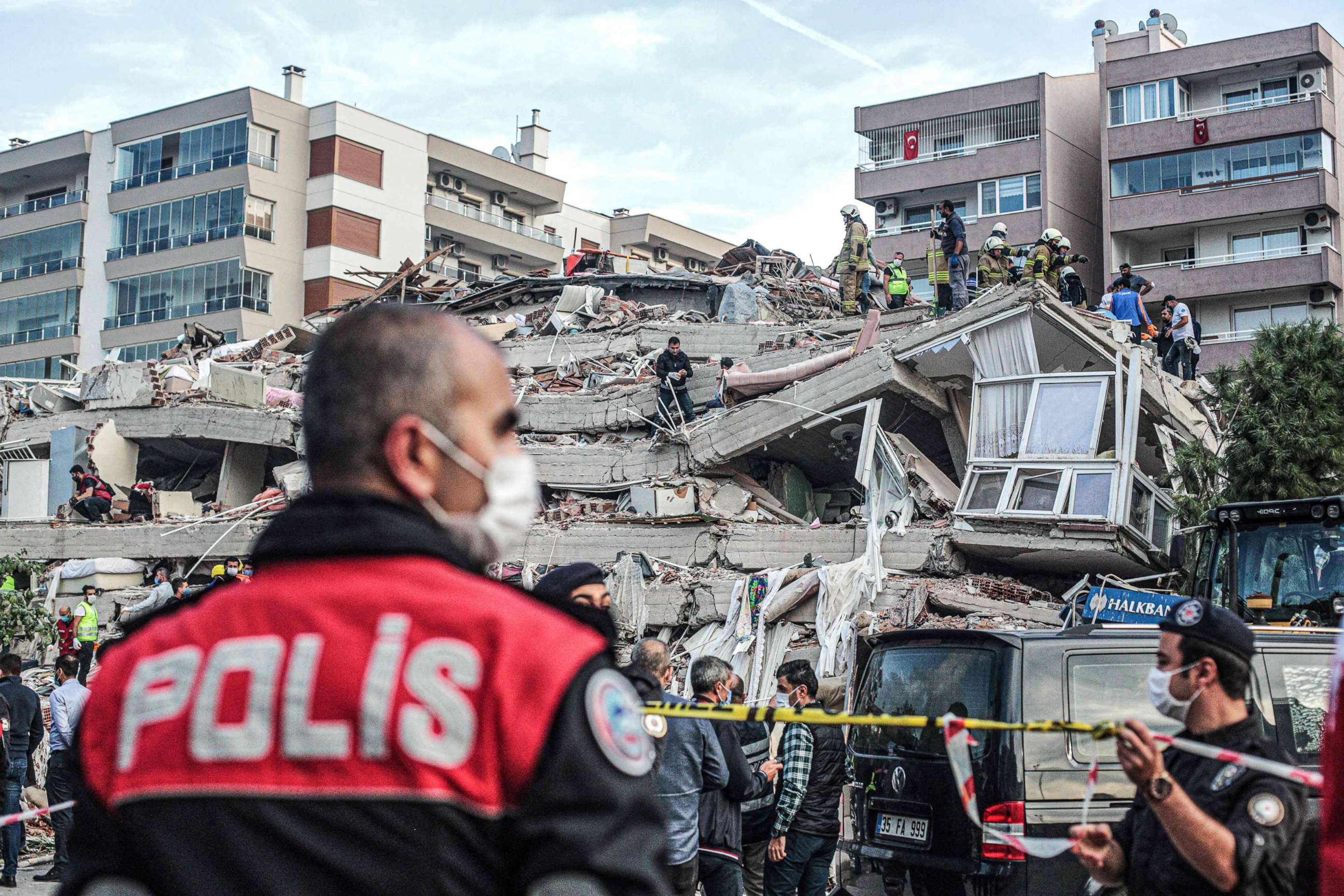 PHOTO: Rescuers search for survivors at a collapsed building after a powerful earthquake struck Turkey's western coast and parts of Greece, in Izmir, on Oct. 30, 2020.